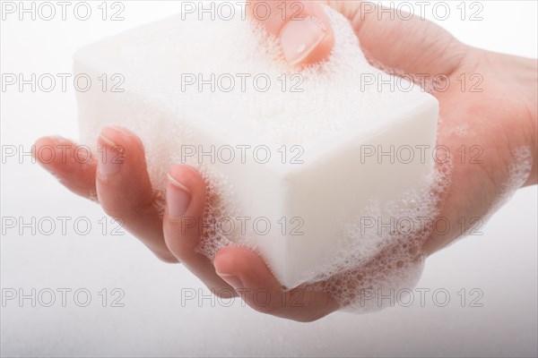 Hand washing and soap foam on a foamy background