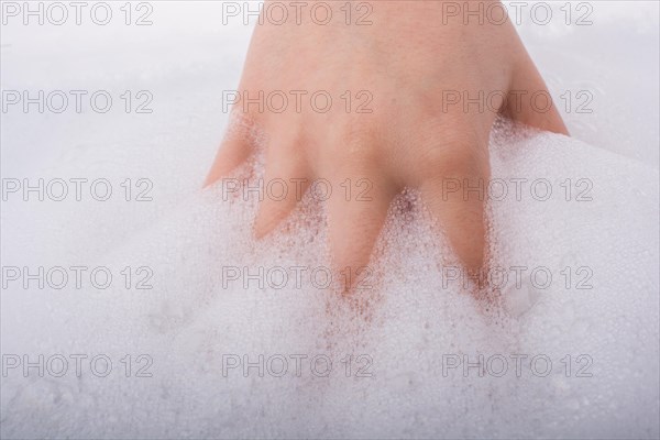 Hand washing and soap foam on a foamy background