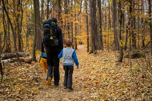 Mum and child are walking along the mountain hiking trail. Family spending time. Polish mountains