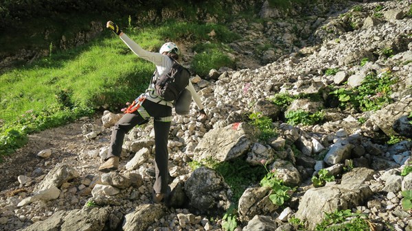 Tourist with equipment on a mountain trail in the Alps. Zugspitze massif