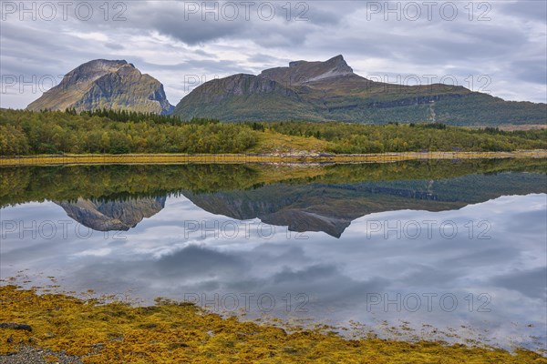 Fjord with reflection of the mountains