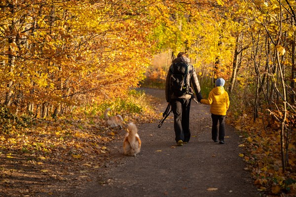 Mum and child are walking along the mountain hiking trail. Family spending time. Polish mountains