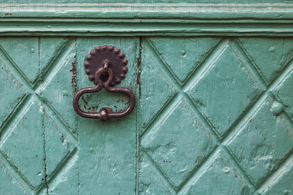 Door knocker on an old wooden door