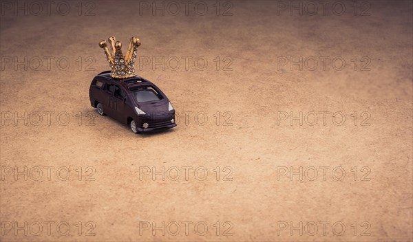 Golden color crown model and a model car