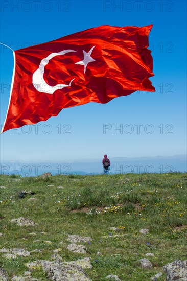 Turkish national flag with white star and moon in air