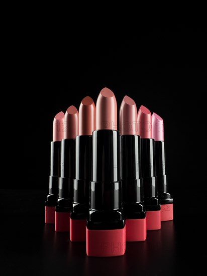 A set of lipsticks on a black background. makeup artist content