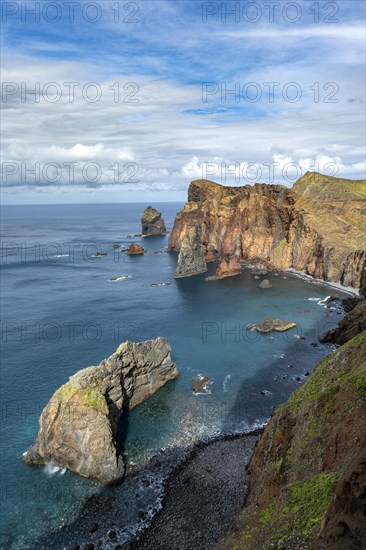 Red cliffs and rocks in the sea