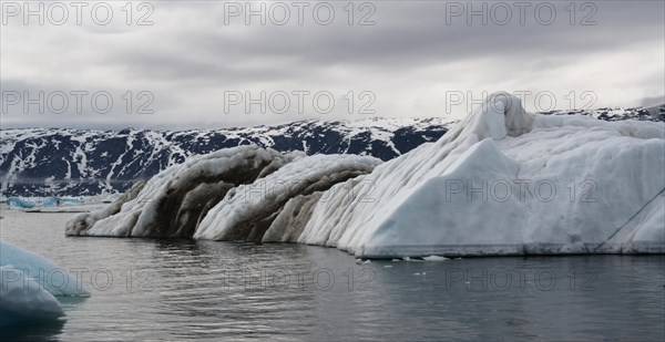 Icebergs in summer on the coast of Disko Bay near Ilulissat