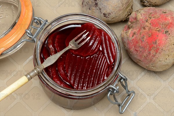 Pickled beetroot in glass jar and beetroot