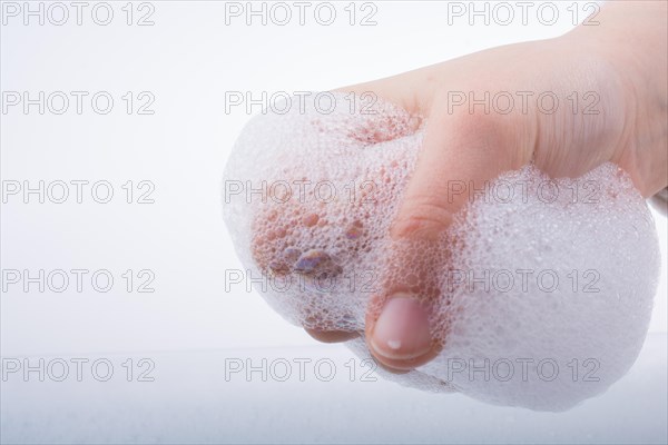 Hand washing and soap foam on a foamy background