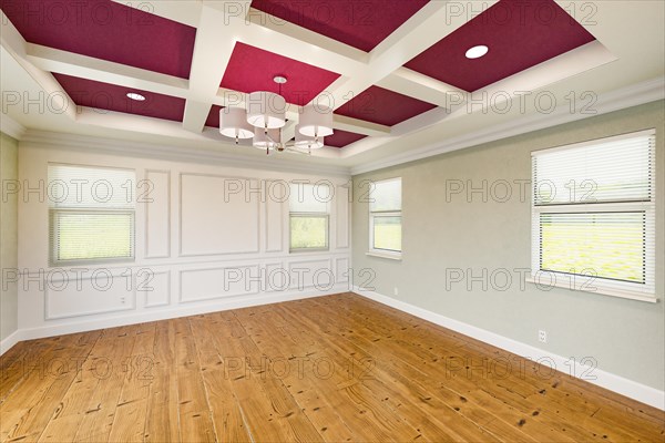 Beautiful purple and tan custom master bedroom complete with entire wainscoting wall