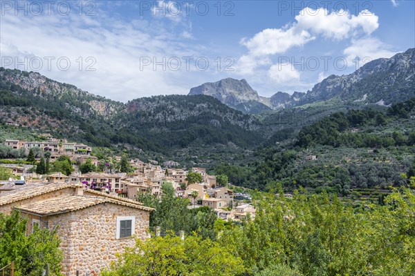 Typical houses of the mountain village Fornalutx with mountain landscape