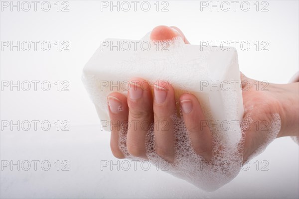 Hand washing and soap foam on a foamy background