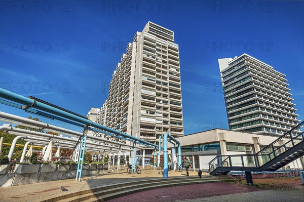 High-rise buildings and blue pipe systems in the former Olympic Village