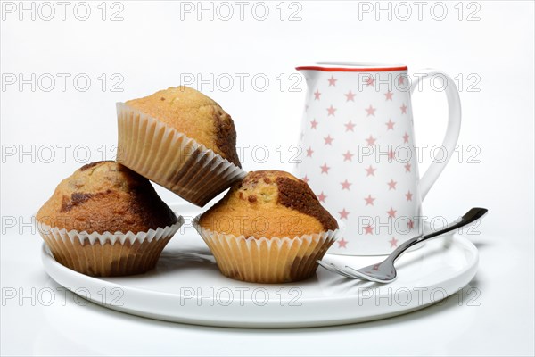Chocolate muffins with milk cane