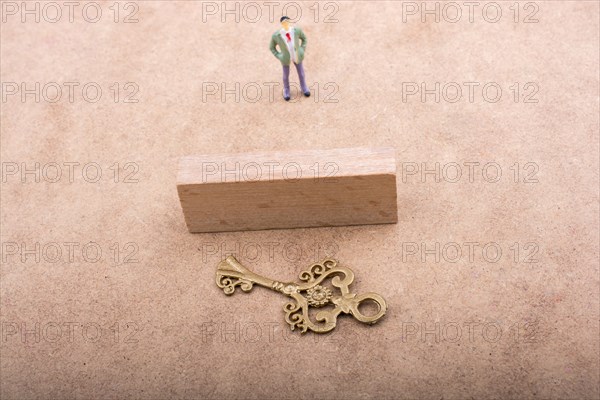 Figurine standing behind retro styled key