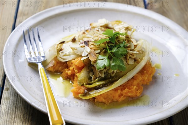 Sweet potato puree with chicory served on a plate