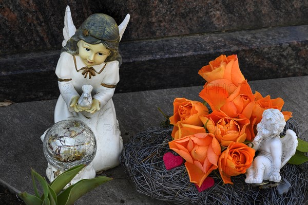 Grave decoration with artificial roses