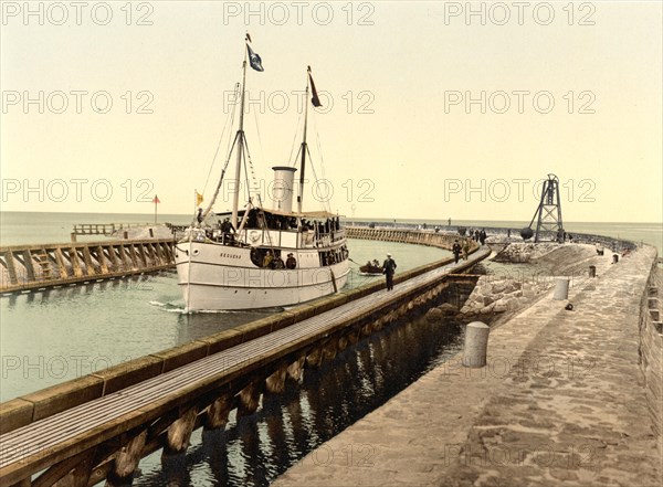 Steamer at the harbour entrance