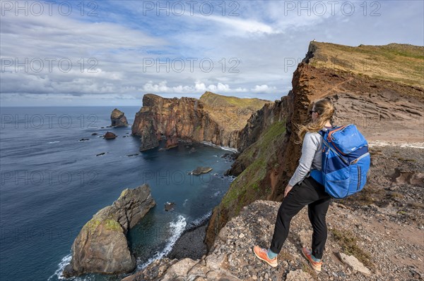Tourist standing on a cliff
