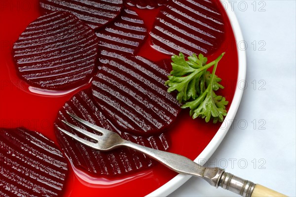 Sliced pickled beetroot on plate