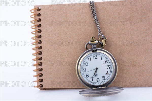 Retro style pocket watch on white background