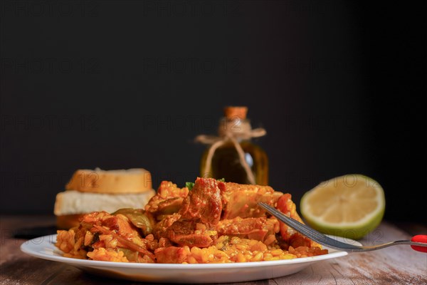 Plate of paella with ribs and green beans