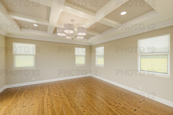 Beautiful tan custom master bedroom complete with fresh paint