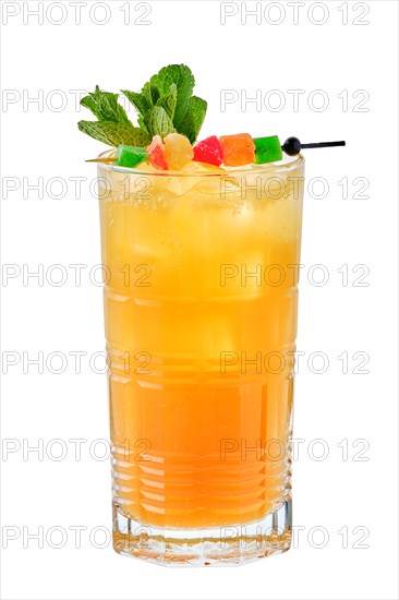 Tall glass of cold mango and passion fruit lemonade isolated on white background