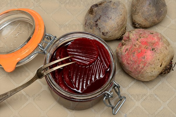 Pickled beetroot in glass jar and beetroot