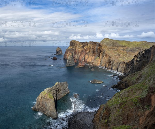 Red cliffs and rocks in the sea