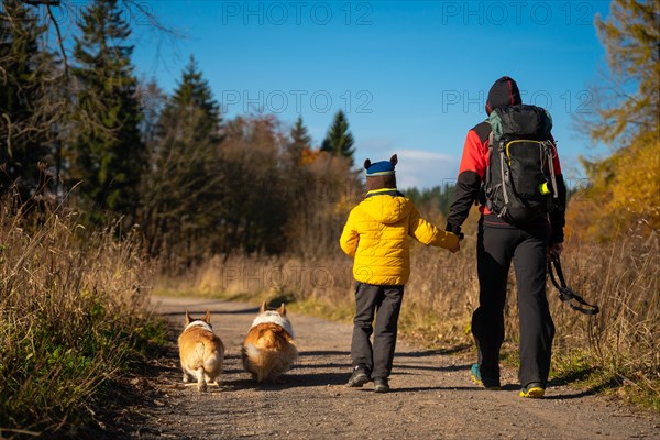 Mum and child are walking along the mountain hiking trail. Family spending time. Polish mountains