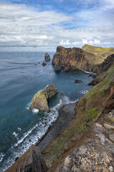 Red cliffs and rocks in the sea