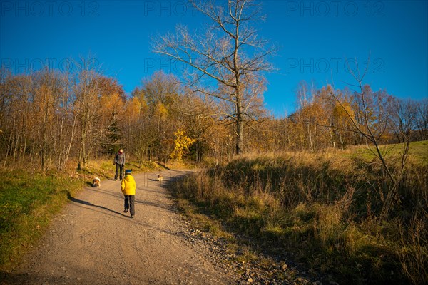 Mum and child are walking along the mountain hiking trail. Family spending time. Polish mountains