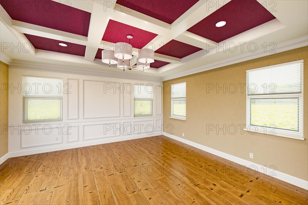 Beautiful purple and tan custom master bedroom complete with entire wainscoting wall
