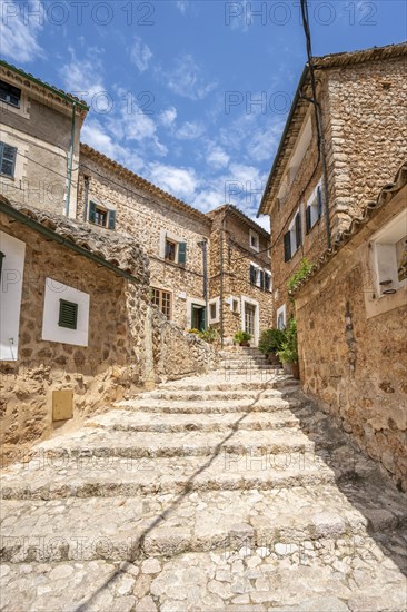 Alley with typical stone houses and stairs