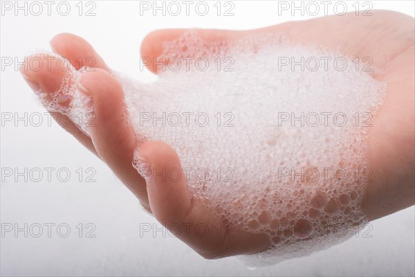 Hand washing and soap foam on a foamy background