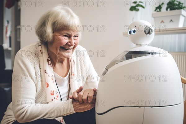 An elderly woman in a retirement home has fun with a care robot