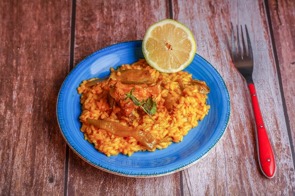 Plate of paella with ribs and green beans