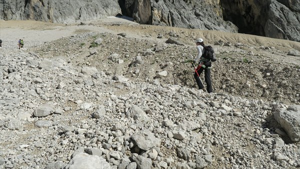 Tourist with equipment on a mountain trail in the Alps. Zugspitze massif