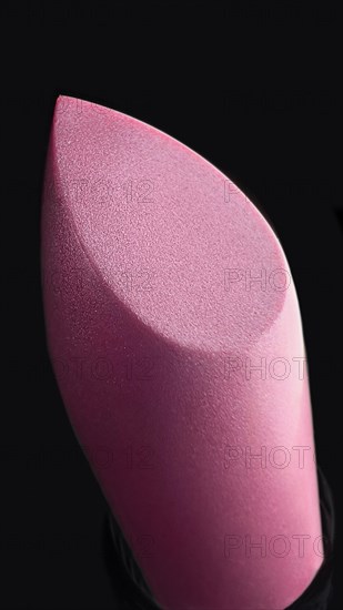 Close-up of lipstick on black background