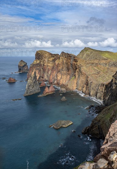 Red cliffs and rocks in the sea