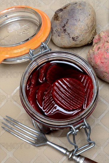 Pickled beetroot in glass jar and beetroot