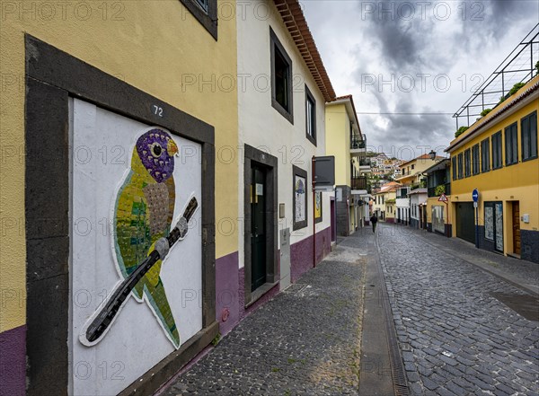 Street with painted house wall