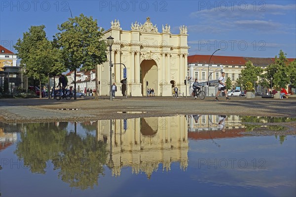 Reflection Brandenburg Gate in puddle