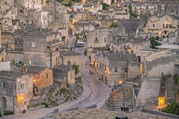 View over the Sassi di Matera complex of cave dwellings at night in the ancient town of Matera
