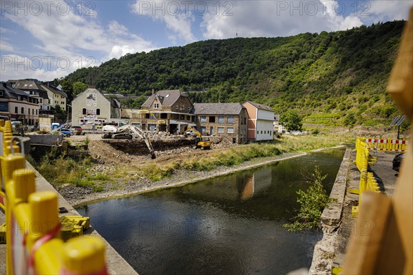 Excavators stand on a construction site in the flood-damaged village of Altenahr. Altenahr