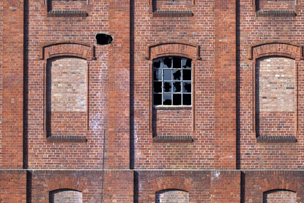 Destroyed window on an old factory building