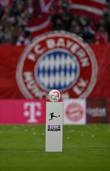Match ball Adidas Derbystar on pedestal in front of FC Bayern Munich logo