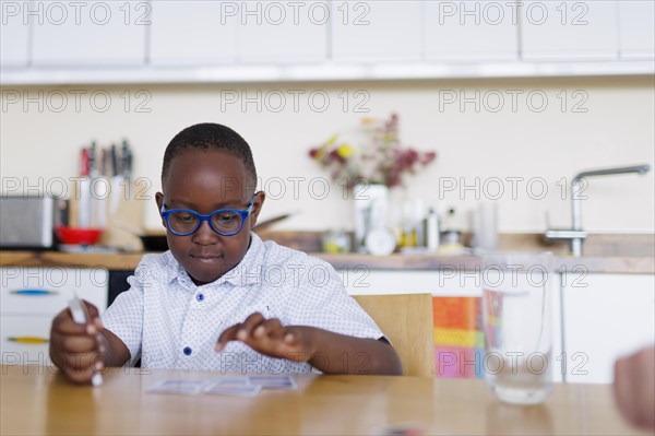 Boy with playing cards